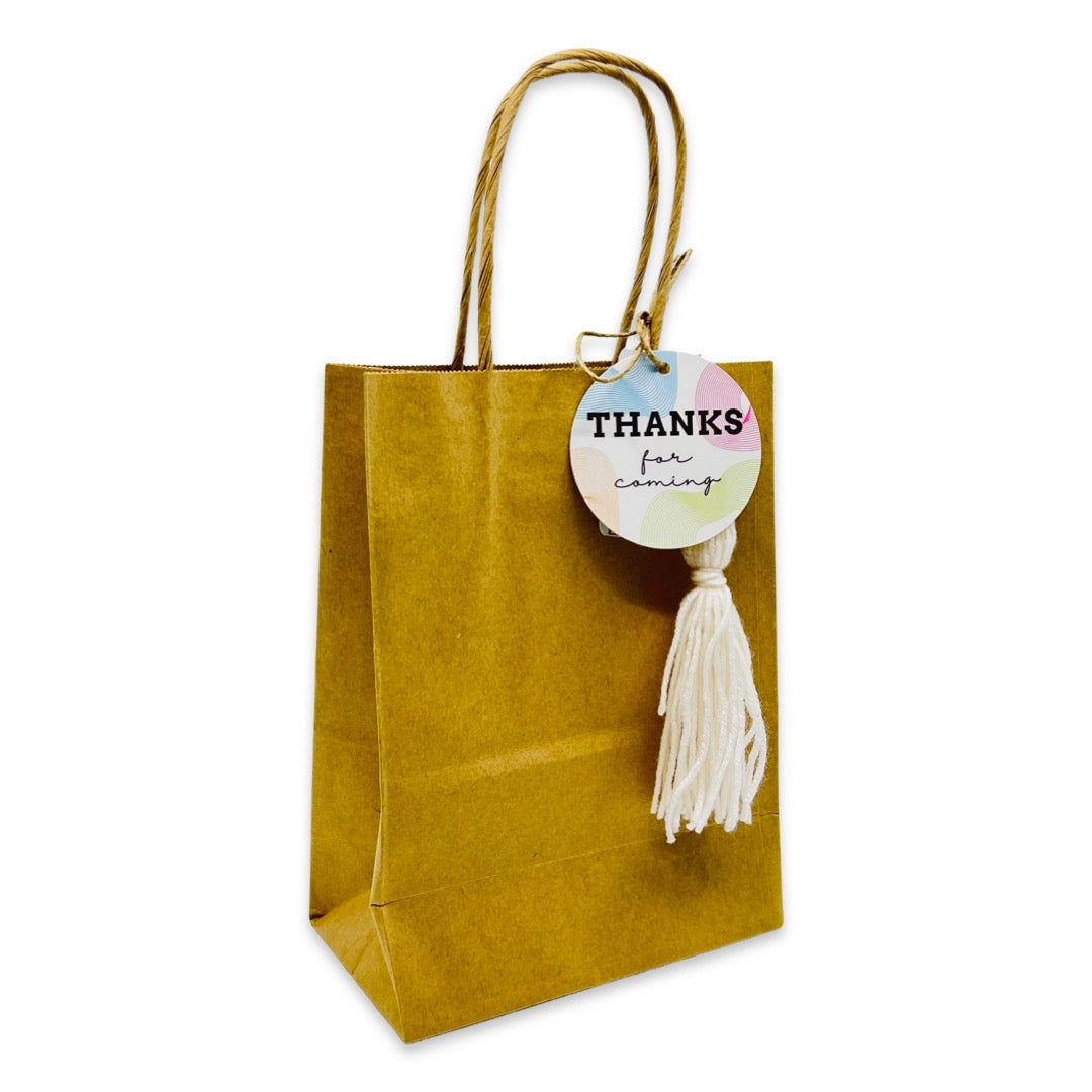 Recycled brown paper bag with twist handles & tassle